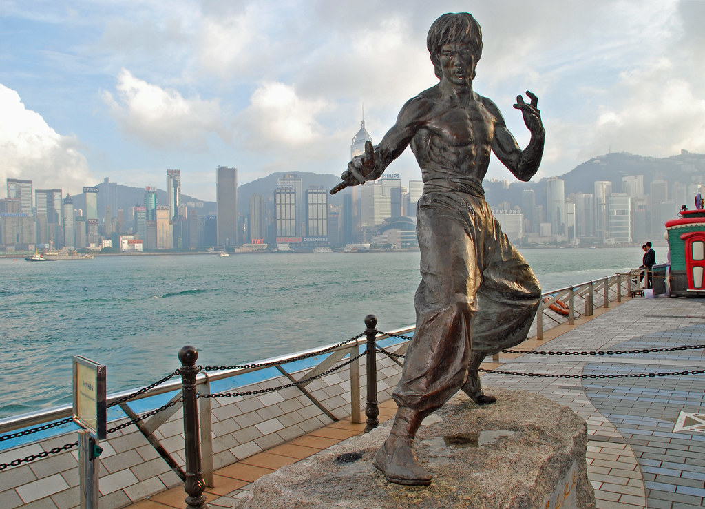 Experience the spirit of Bruce Lee against Hong Kong's stunning skyline. Explore iconic landmarks and immerse yourself in Wing Chun connecting with the legacy of martial arts greatness.